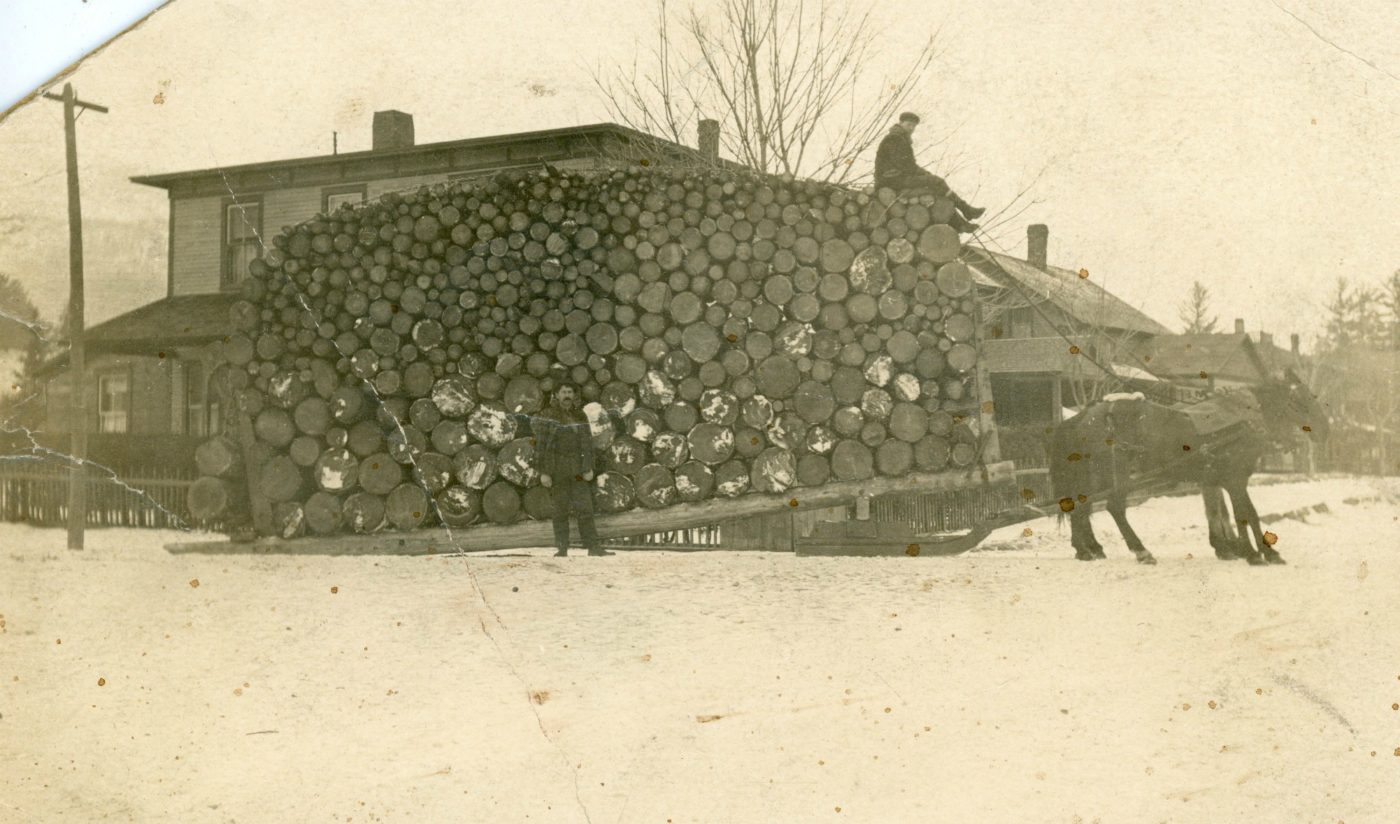 Large load of horsedrawn pulp wood in Keene