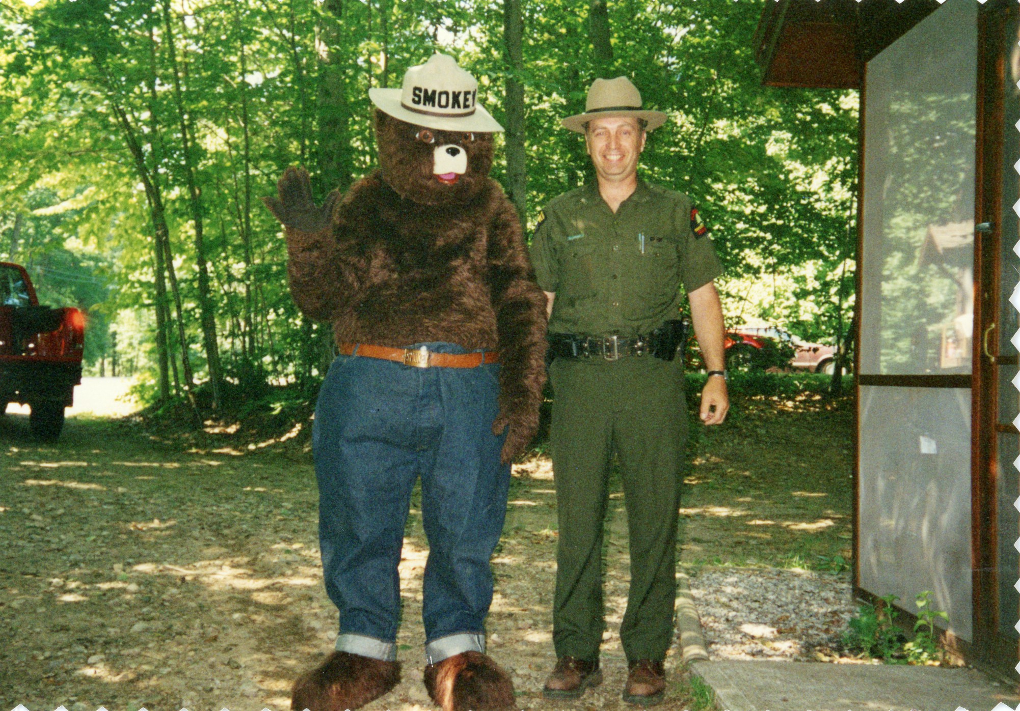 Forest ranger with Smokey the Bear at a campground in Cranberry Lake