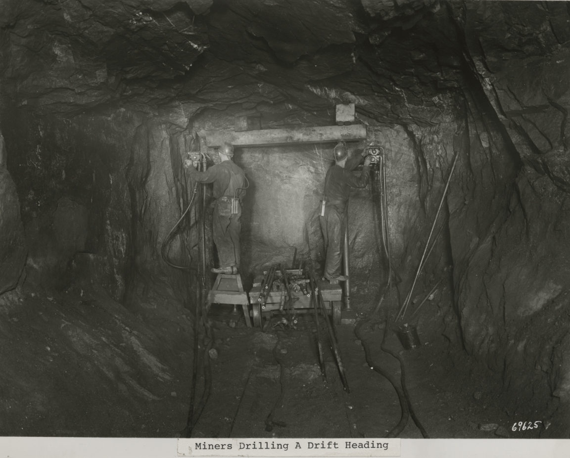 Miners drill a drift heading in the Republic Steel Mines in Mineville